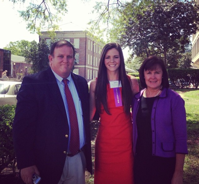 Meredith with her parents following her research presentation